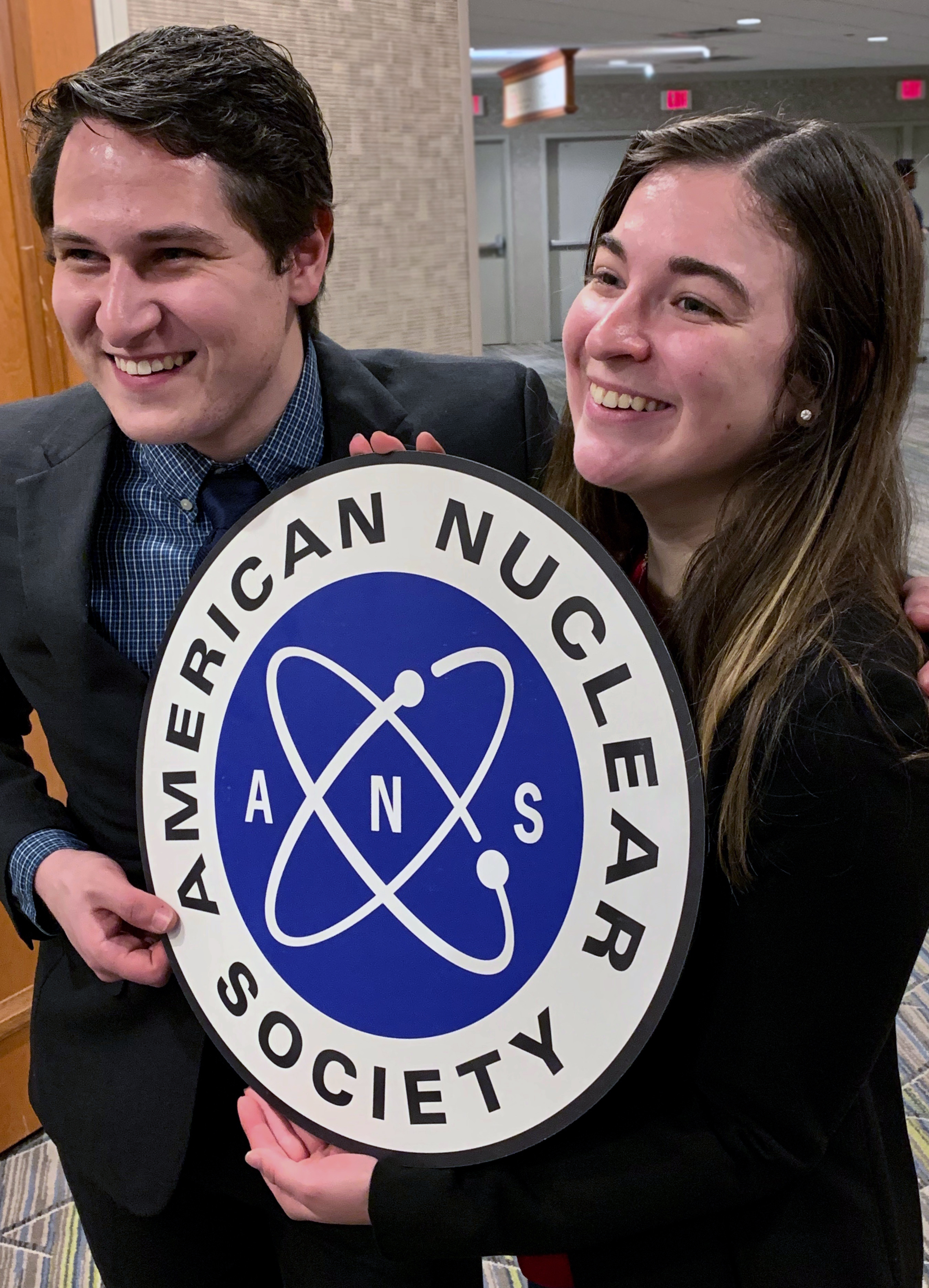 NPRE alum Katie Mummah, right, celebrated the Illinois chapter's designation with organizers Jeremy Mettler (left), and Sam Dotson and Nate Reid (not pictured).