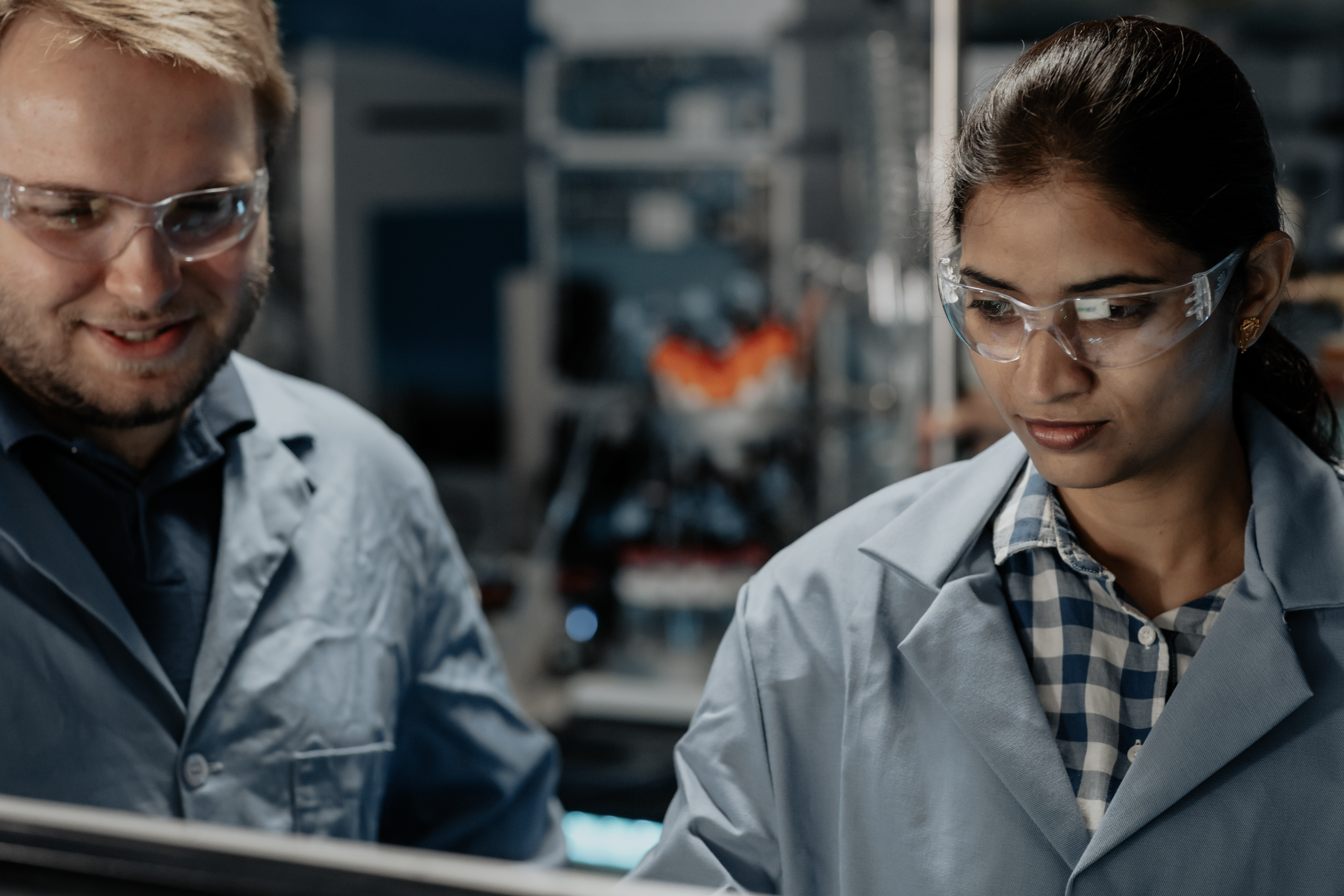 two students working on a project in a lab